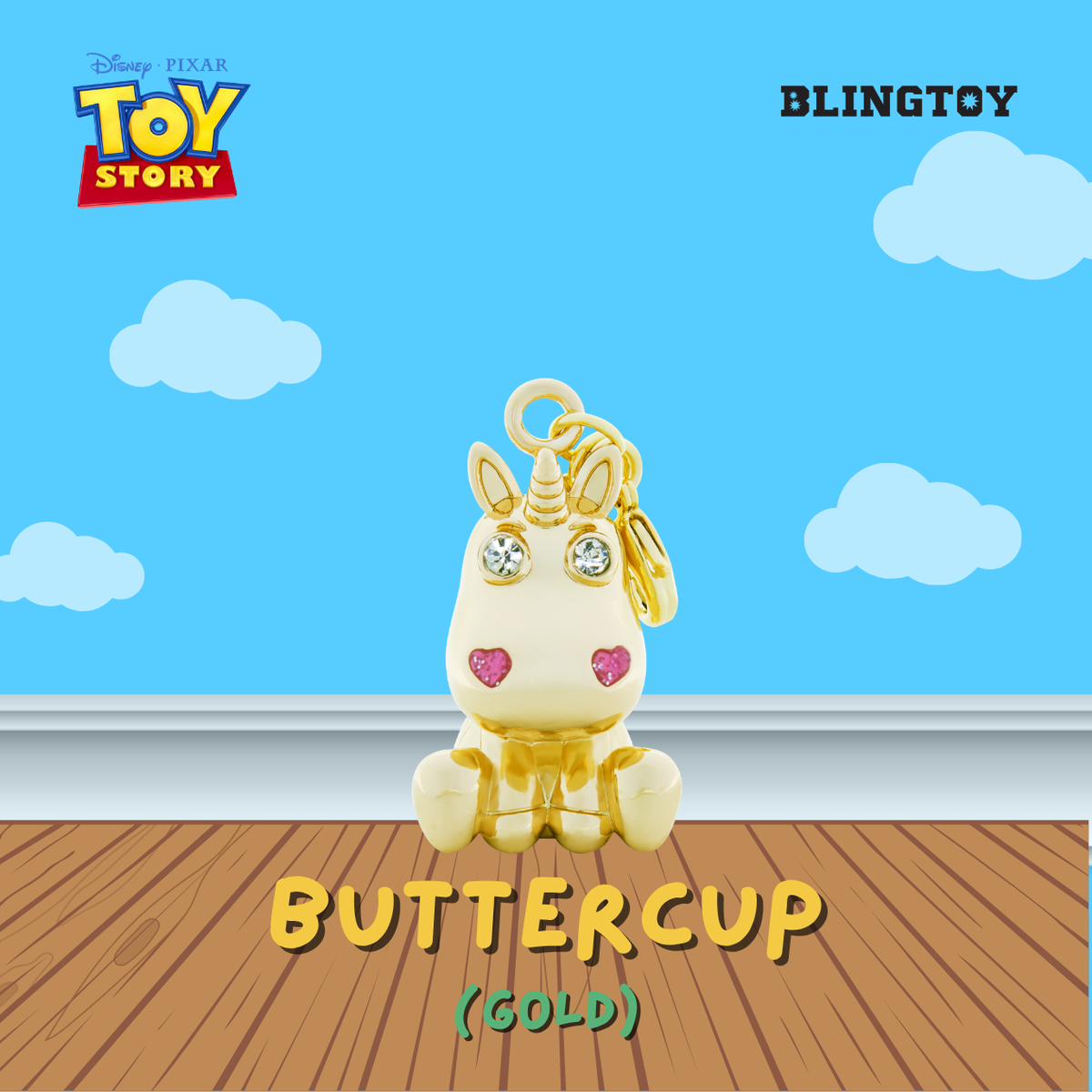A gold-plated Disney Pixar Toy Story Buttercup keychain charm with rhinestone eyes and pink heart details, displayed on a wooden floor against a blue sky background with clouds. The logos for Disney Pixar Toy Story and BLINGTOY are visible.