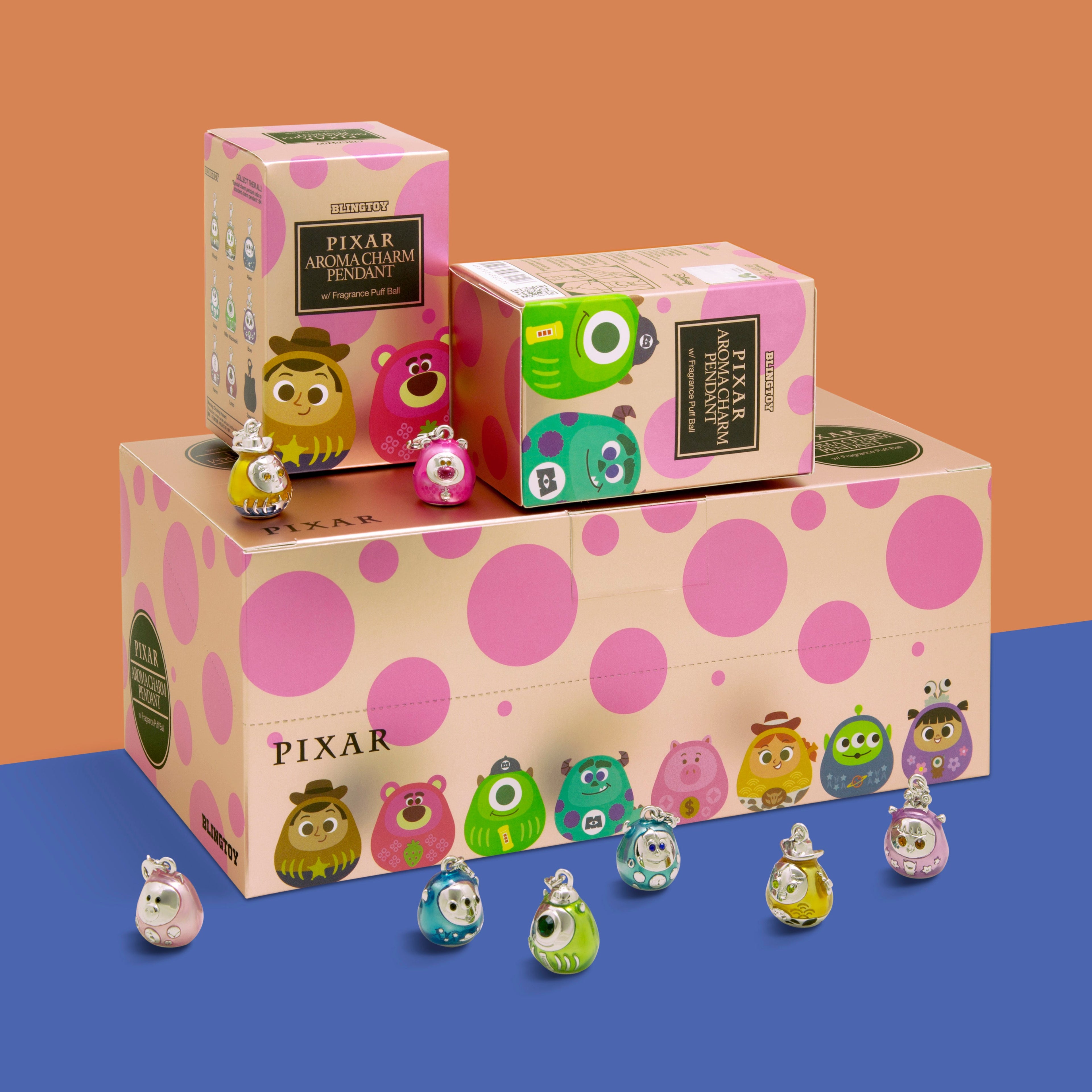 Pixar Toy Story mosters inc blind box set with multiple colorful character figures displayed on and around the boxes against a two-tone orange and blue background.